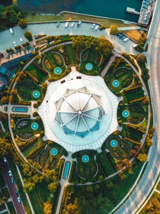 this aerial po shows a circular flower garden with fountain