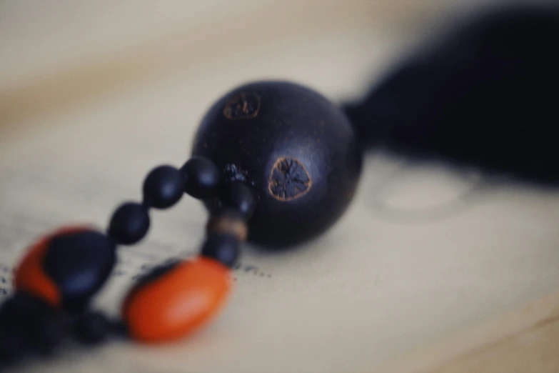 a close up of beads and a book