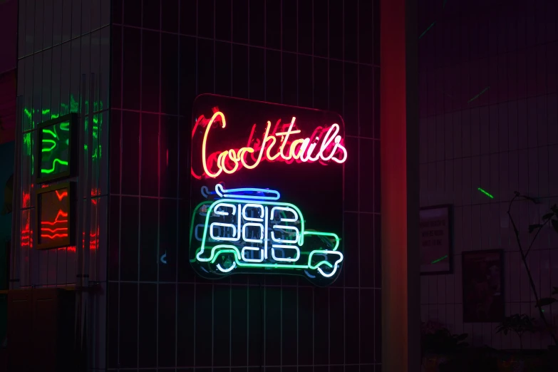 a restaurant with colorful neon signs and advertits at night