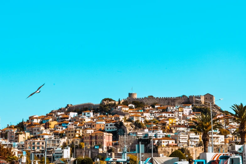 an image of a view of some buildings on the top of a mountain