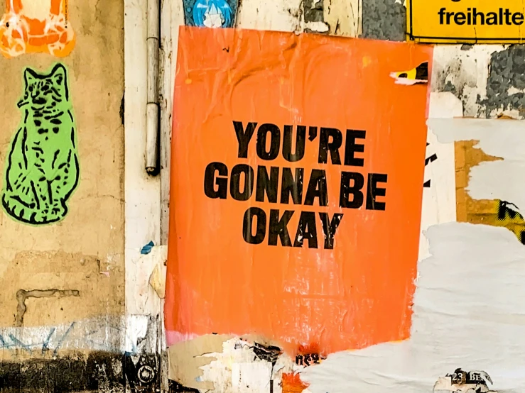 a sign has been altered to say you're gonenna be okay