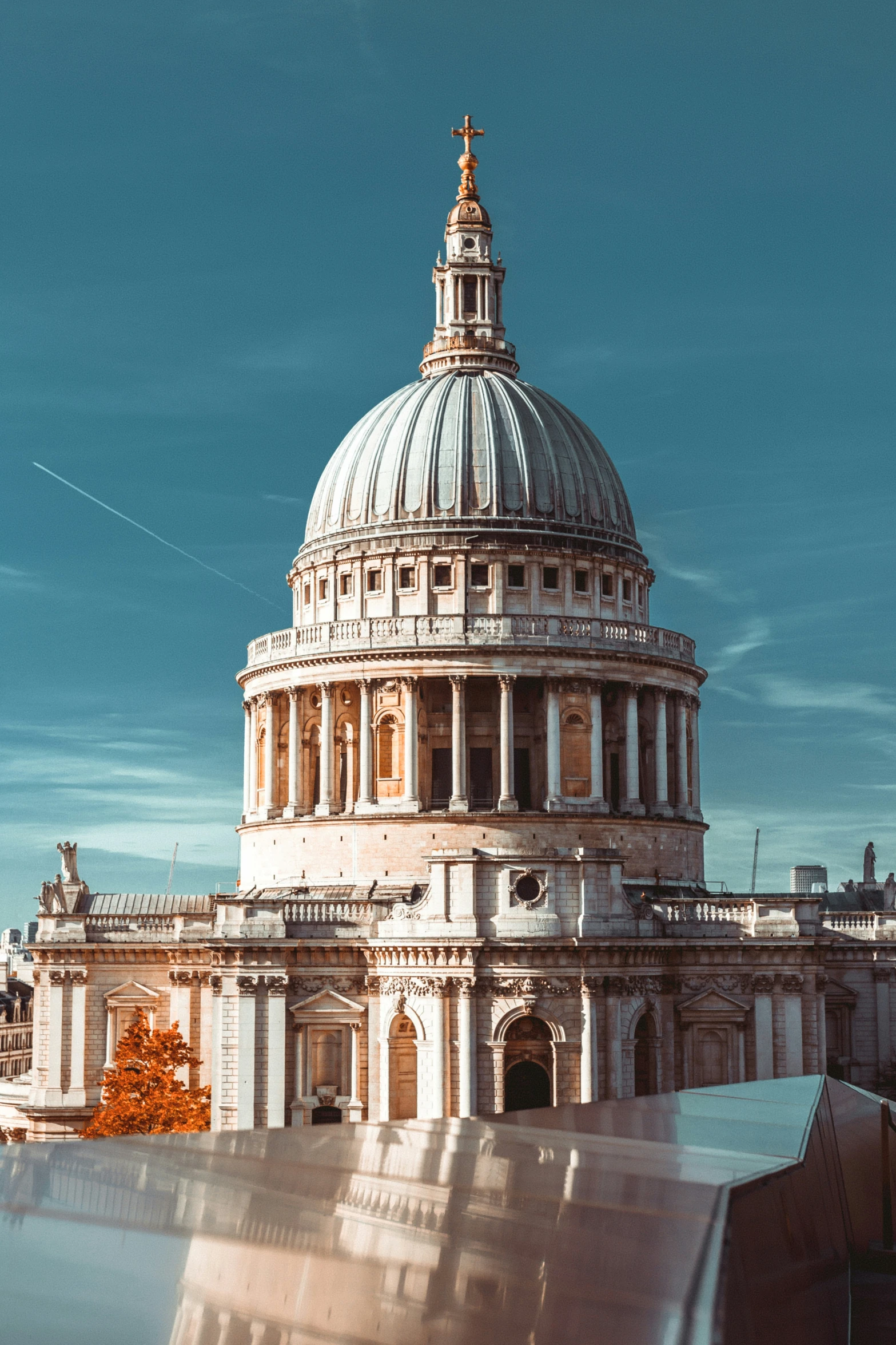 a large building with a dome with a clock on it