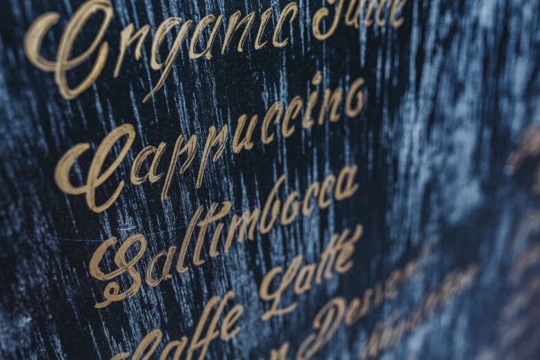 the writing is gold on an embossing wood
