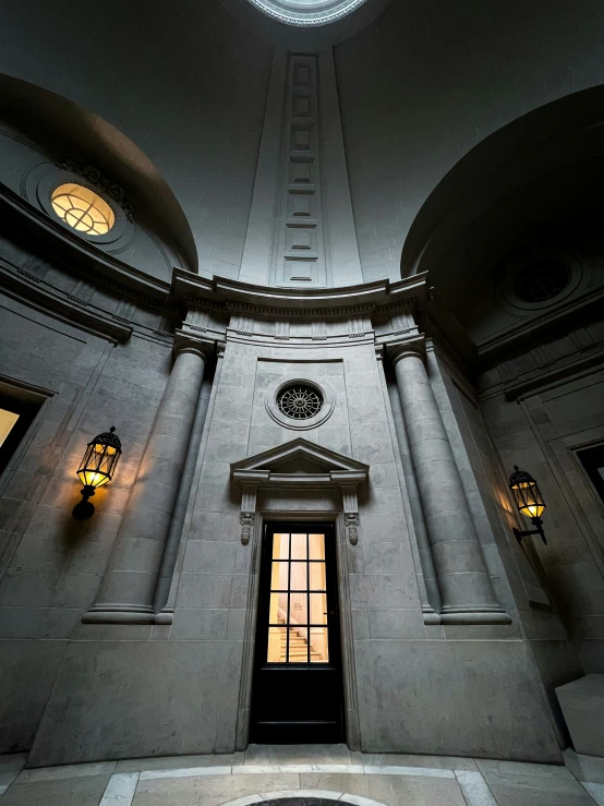 inside the lobby of the building has two lanterns and some lamps