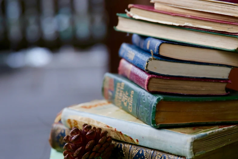 several books sitting on top of each other