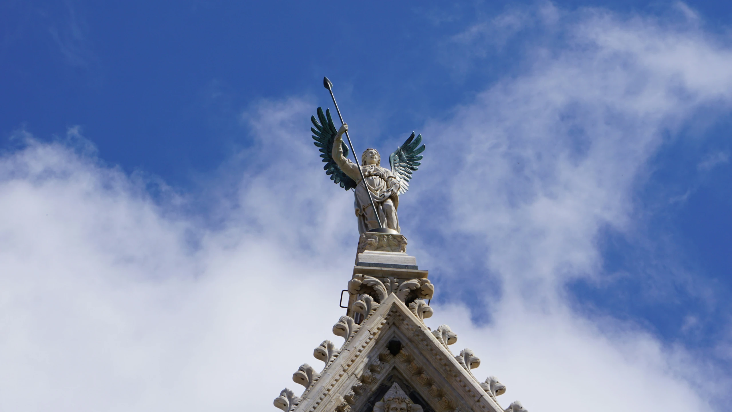 a tall statue on top of a tower