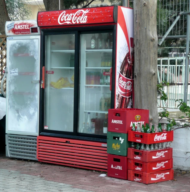 a very small ice cream machine with coca cola on the outside