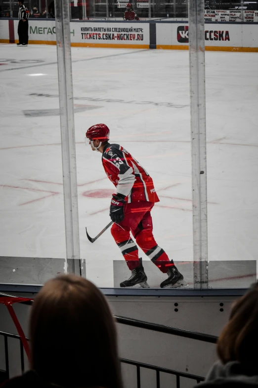 a hockey player is playing in a stadium