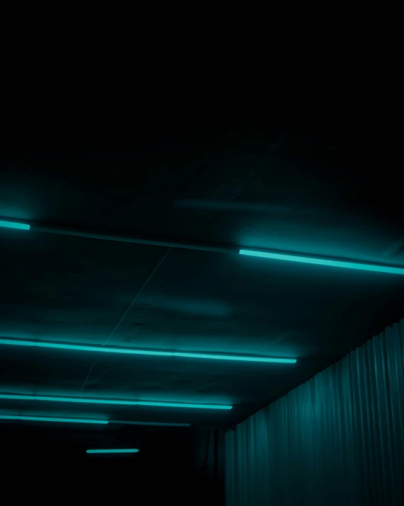 a corridor with lights that are in the ceiling