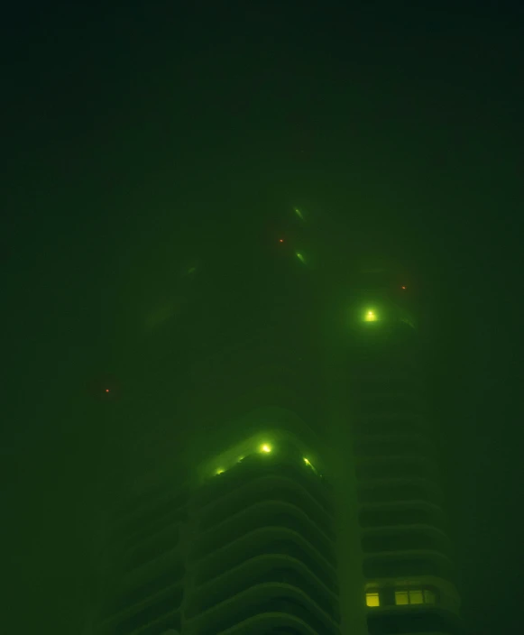a big building in a very green light