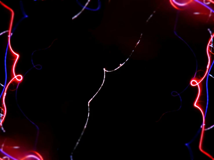 a very colorful dark background with red and blue circles and lines