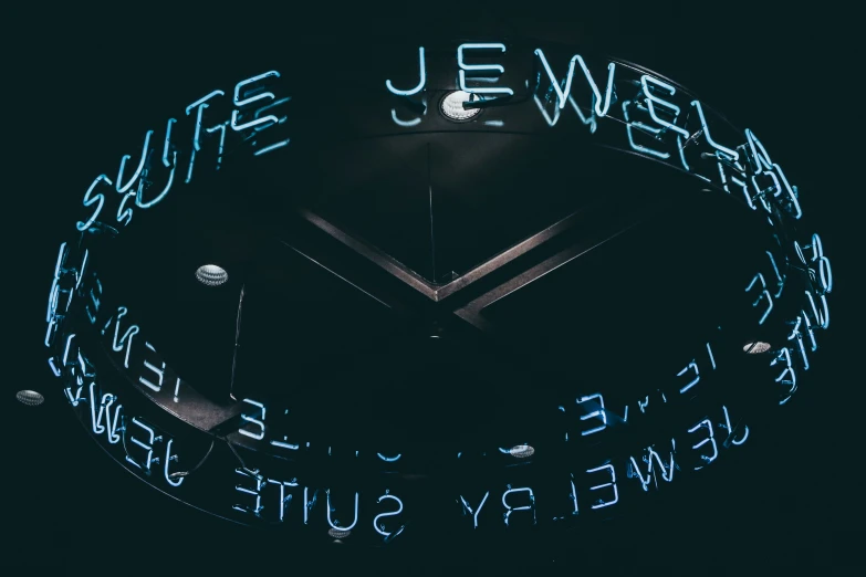 a neon clock with a blue glow shining