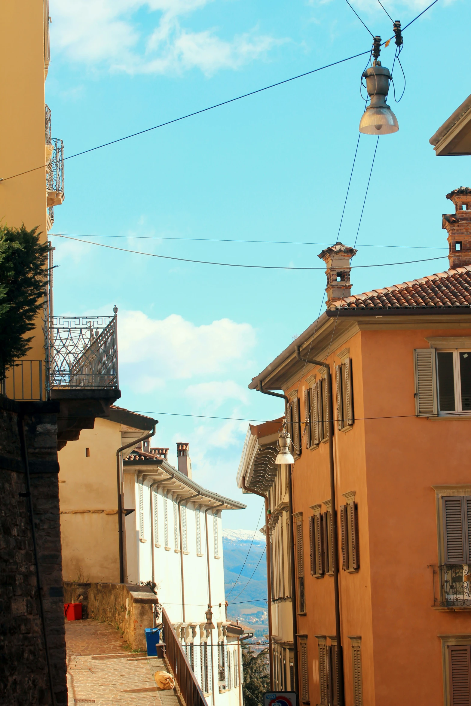 some buildings that are on a hill and a sky