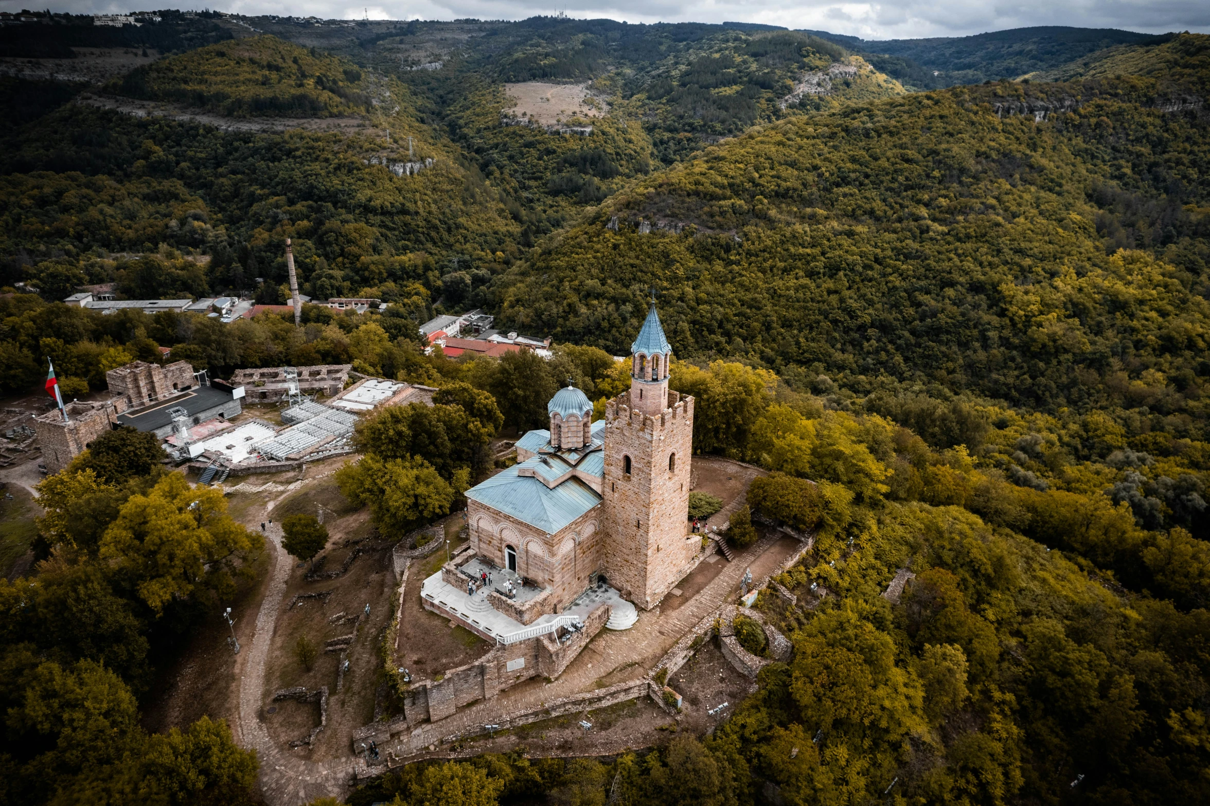 an old church in a very large area of trees