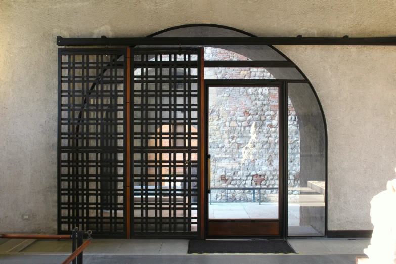 the arched window inside the building shows the inside courtyard