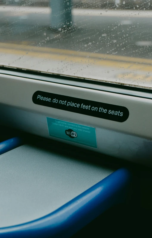 a train with blue handles and a message on the window