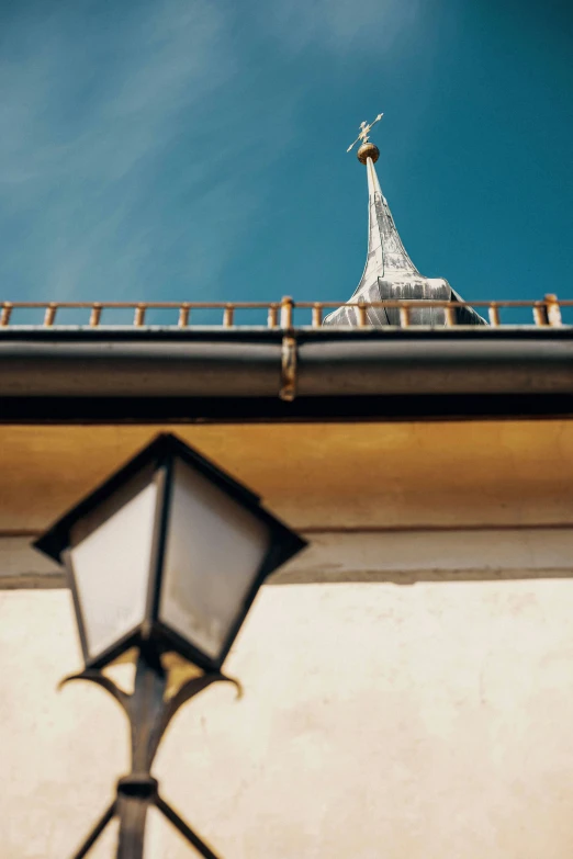 a lamp that is sitting on a building