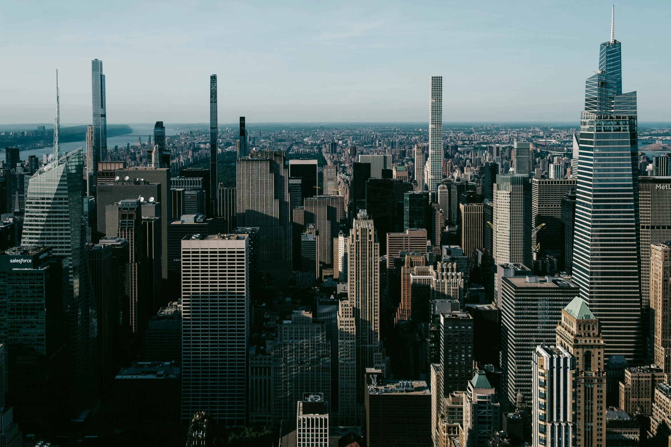 an overhead view of a city, with tall buildings