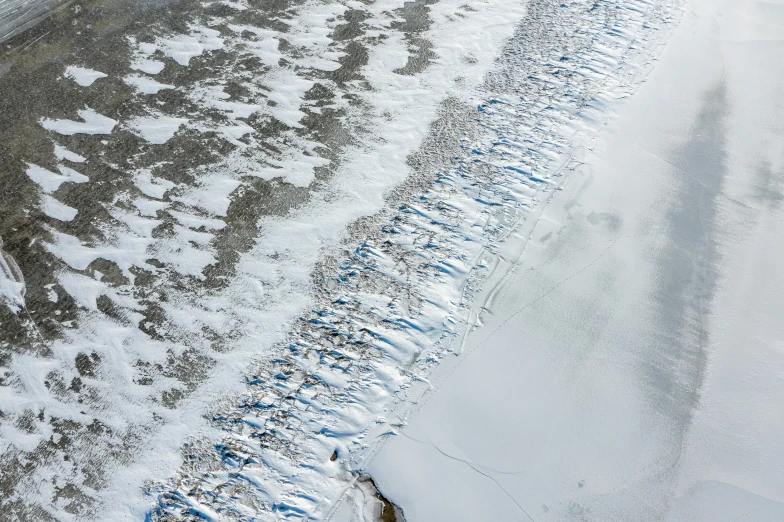 an aerial view of snow covered streets and sidewalks