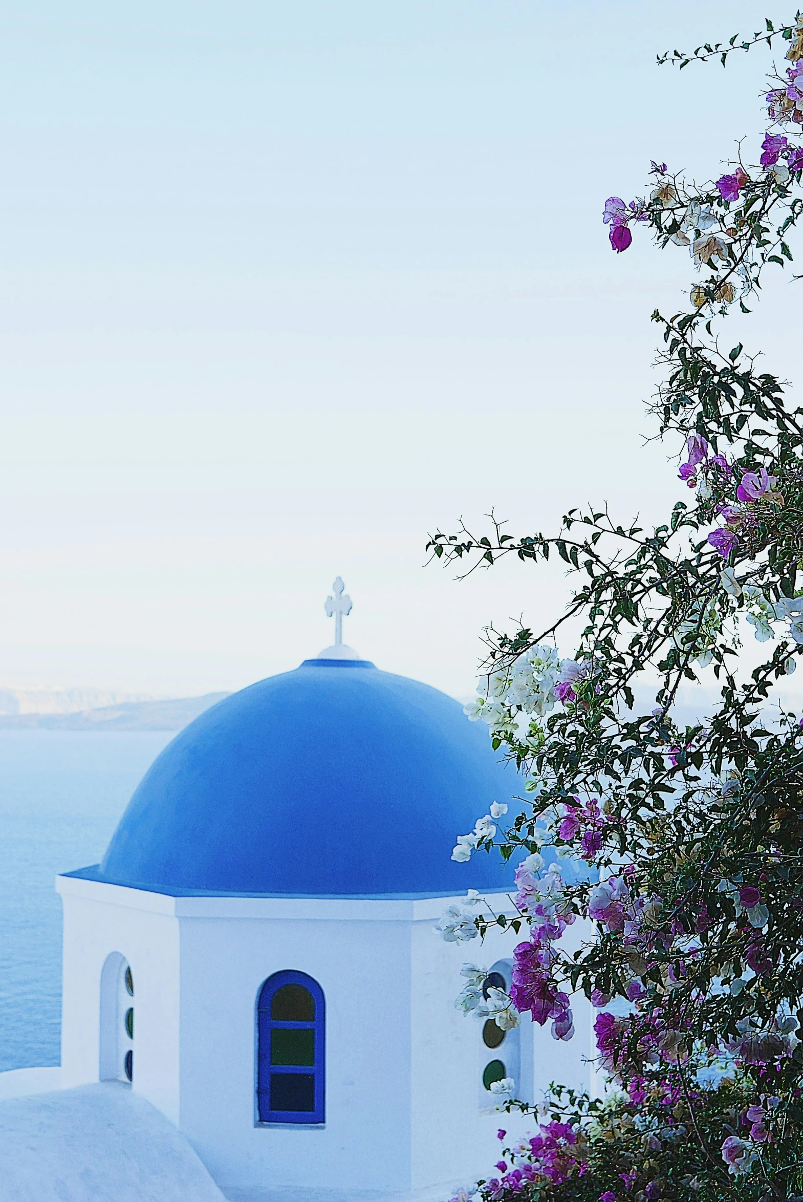 a blue dome with a view of the ocean