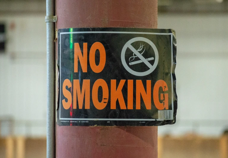 an electronic cigarette sticker on a pole