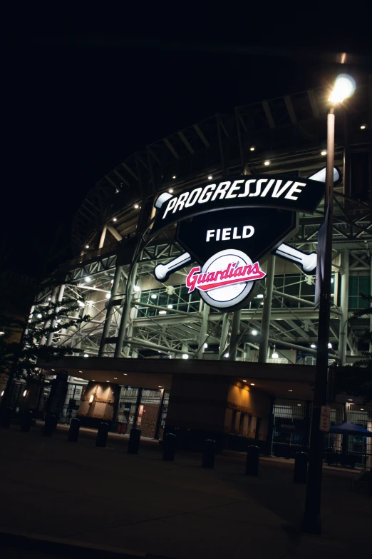 the outside of a baseball stadium at night