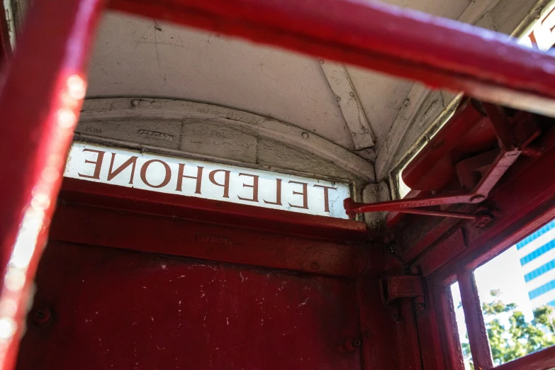 a red phone booth sign above the entrance