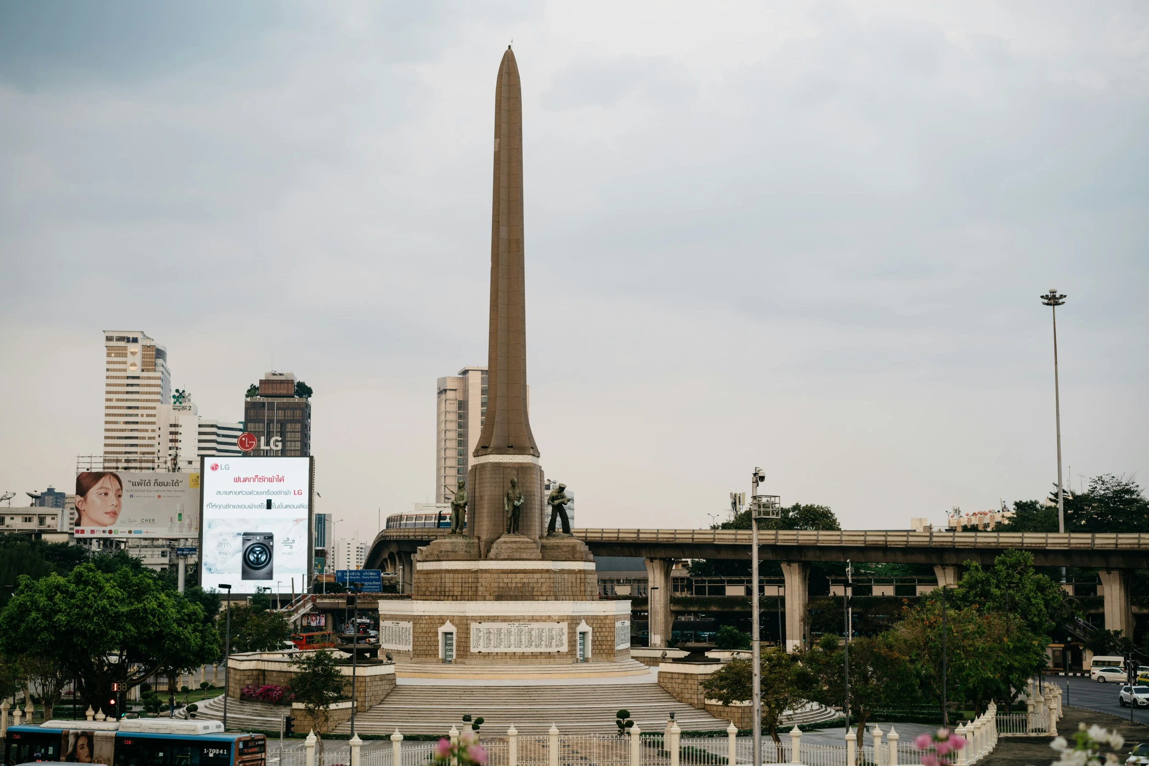 a tall, obelisk with a massive sign at the top