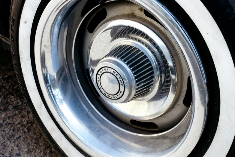 close up of a metallic tire with the spokes in it