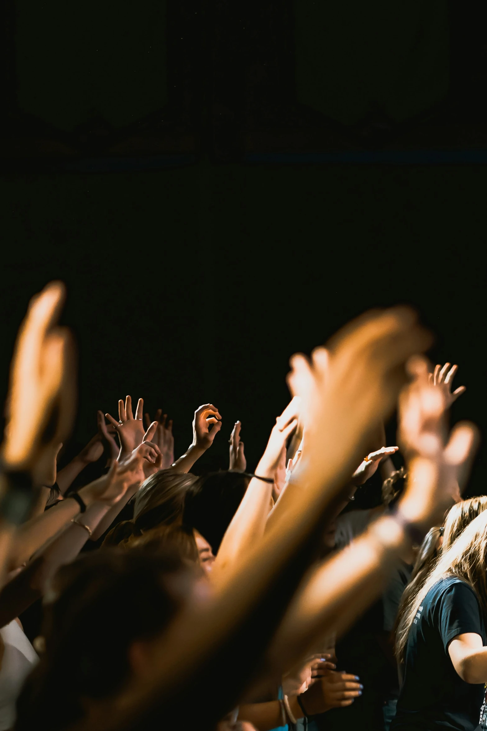 a man holding his hands in the air