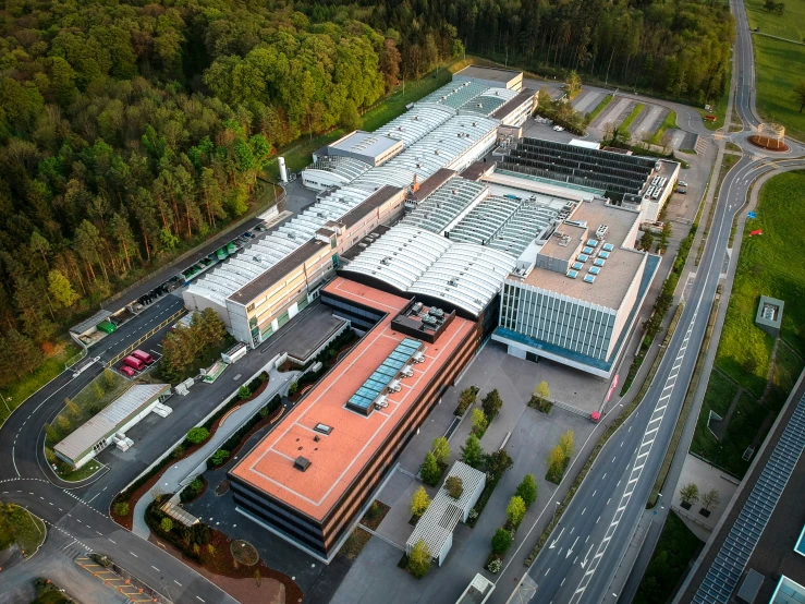 a factory building in the middle of a forest