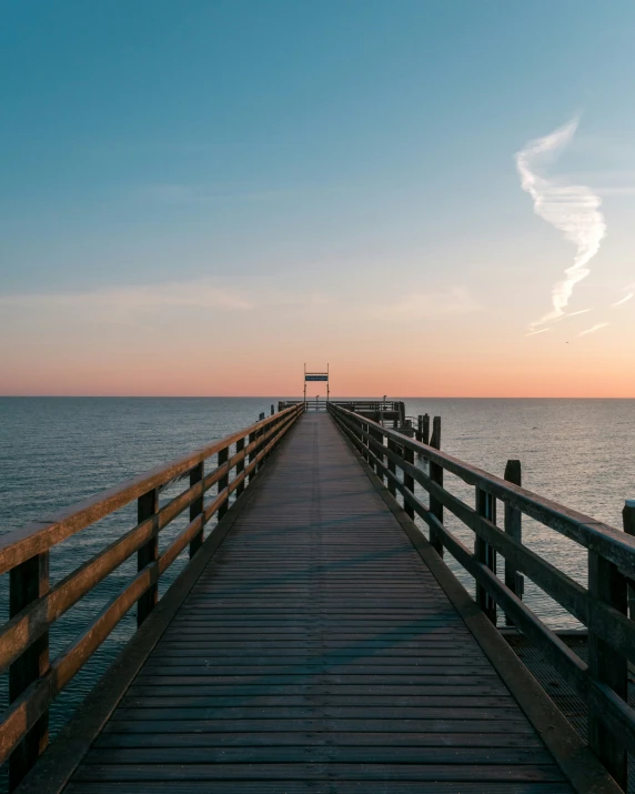 a dock on the water that is very long