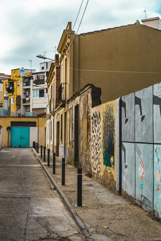 a building with graffiti on the wall and windows