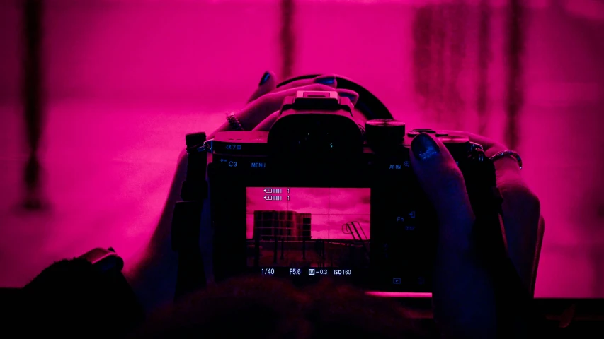 someone taking a pograph of the building through an infrared camera