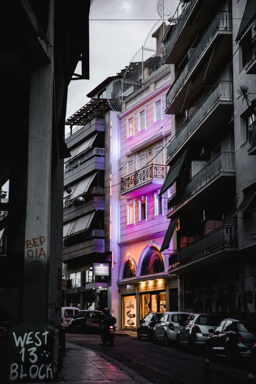 an outside view of many apartment buildings and a purple building