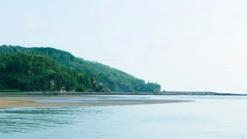 an ocean view with many small islands on one side