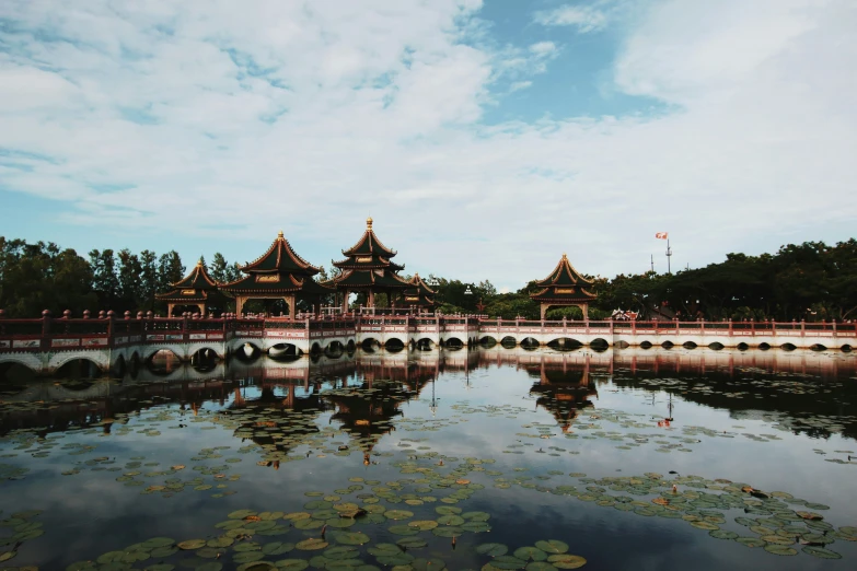 a bridge in the distance over a lake