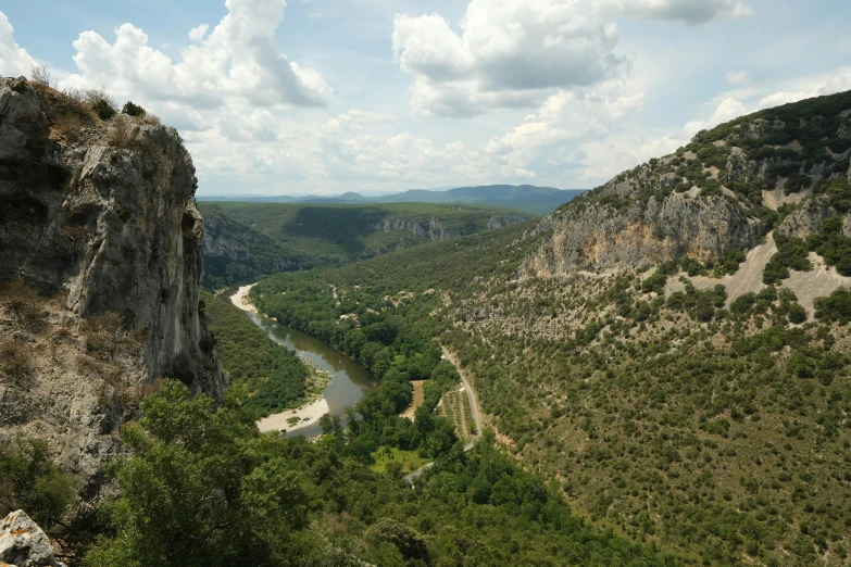 the landscape is shown with mountains, trees and small rivers