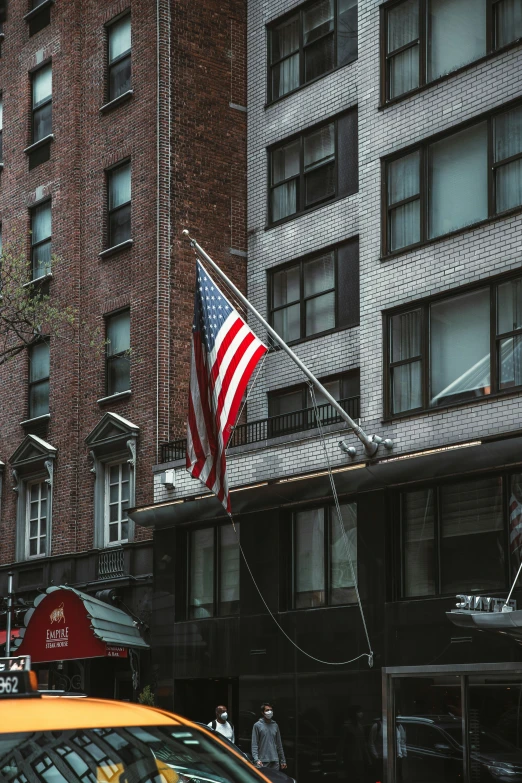 a car with a large american flag on the top of it