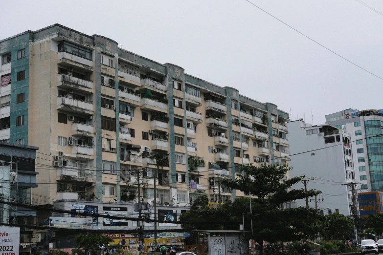 an odd looking building surrounded by tall buildings