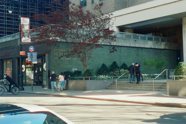 a group of people standing outside a building