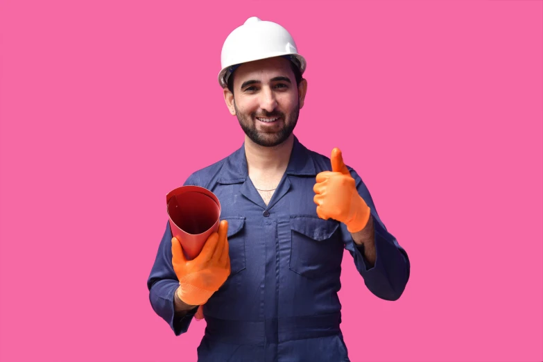 a man is holding a pair of gloves and giving the thumbs up