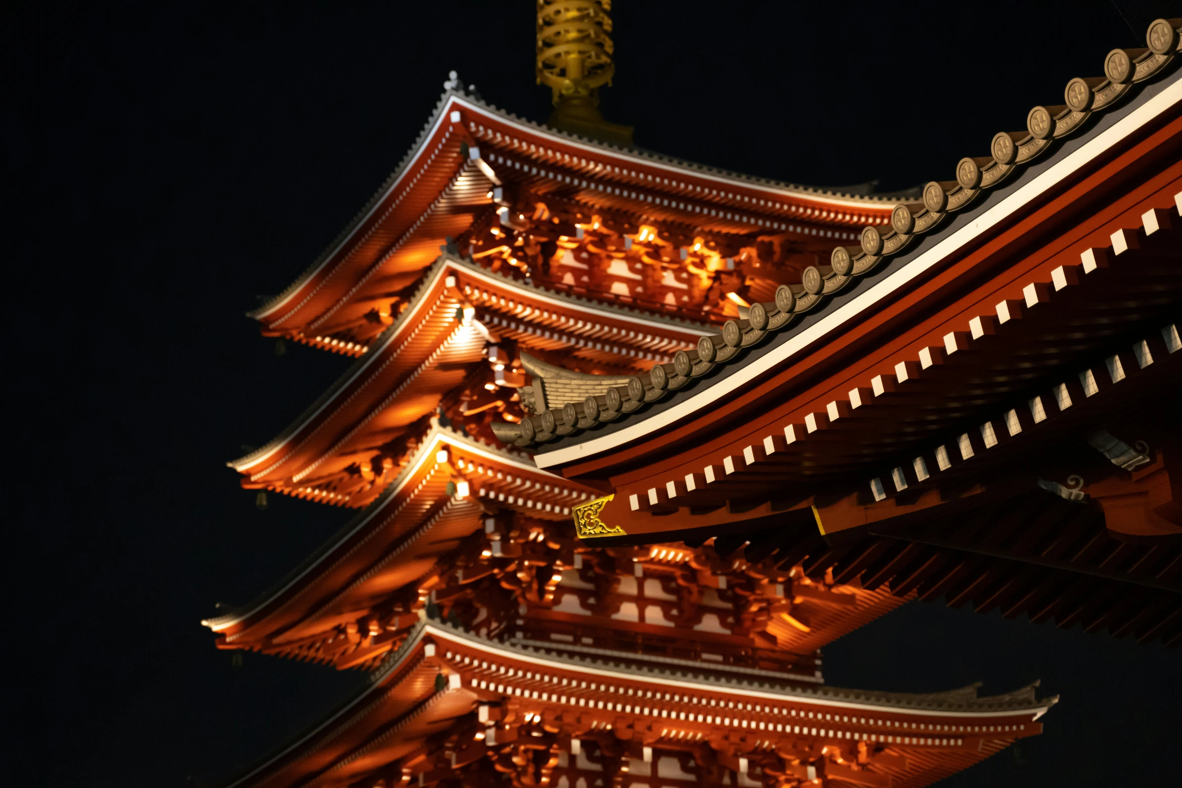 an orange building with a tall gold roof