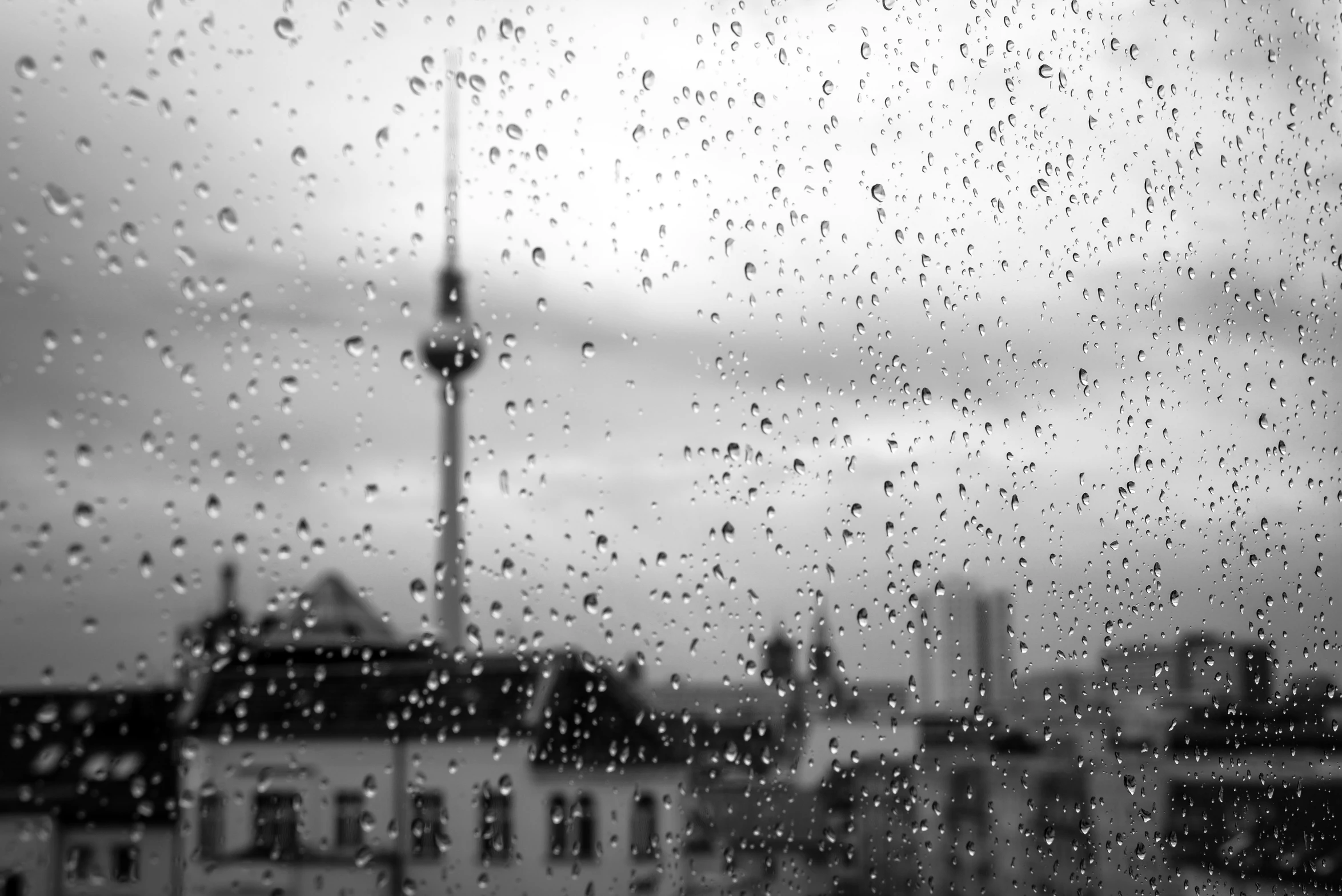 a very pretty view of buildings through the rain