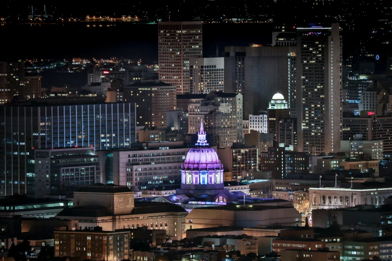 a city that has very large buildings at night