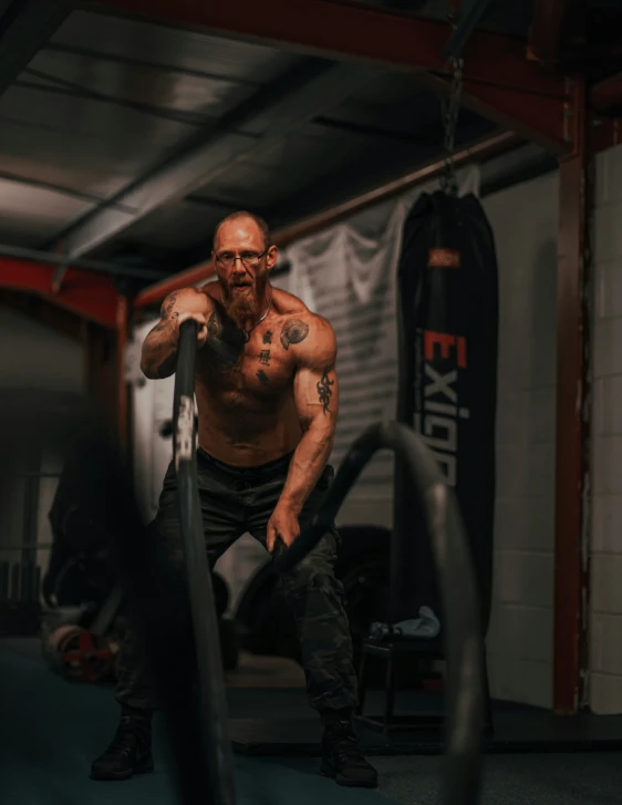 a man standing in a gym doing exercises