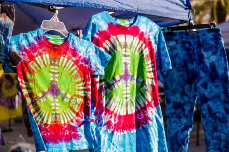 tie - dyed shirts hanging out in the sun
