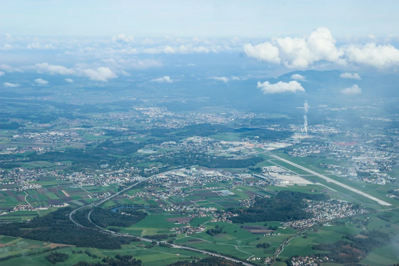 an aerial view of town and city in rural area