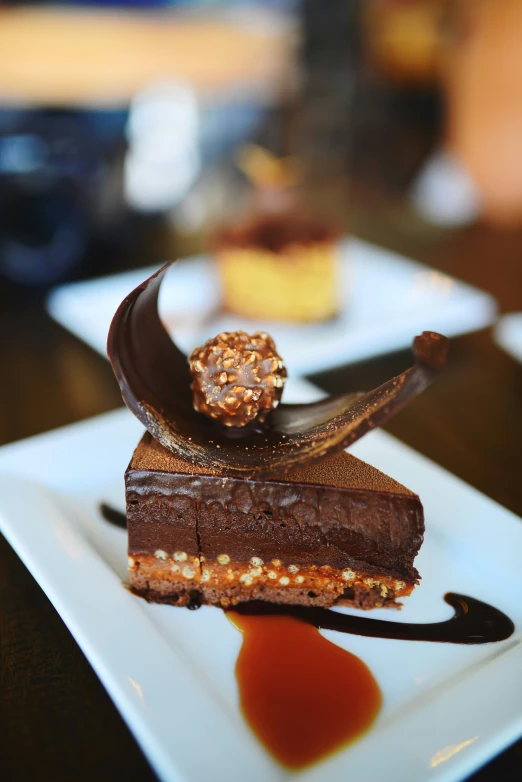 the dessert is covered with chocolate, caramel and caramel