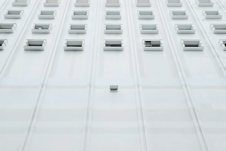 the roof of a large building that contains windows